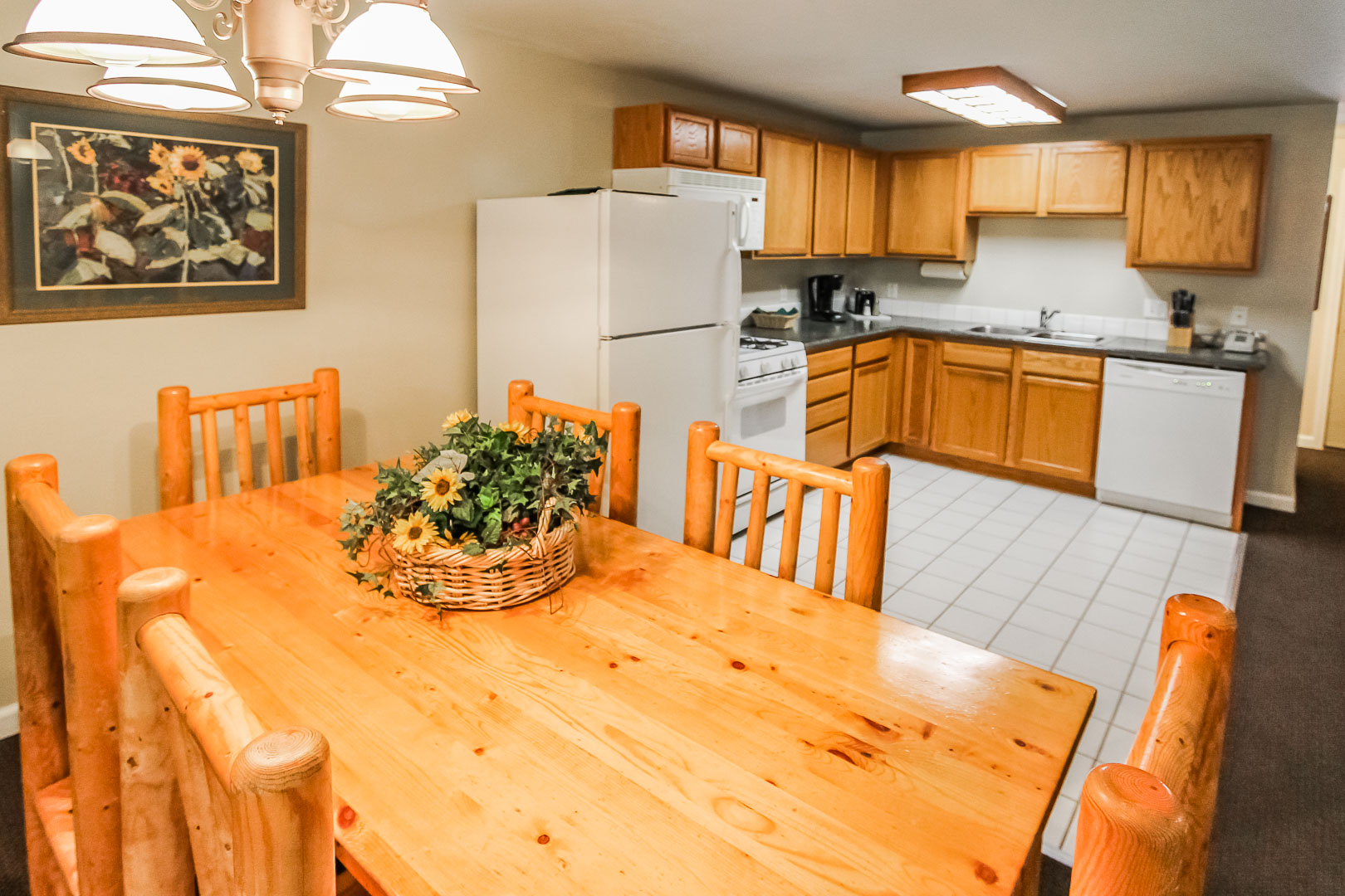 A dining room and spacious kitchen at VRI's Jackson Pines in Wyoming.